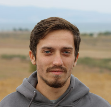 a man in a gray hoodie