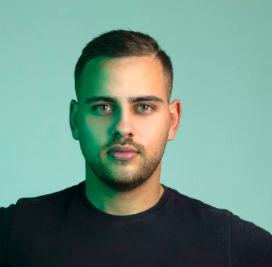 a man with a beard on a blue background