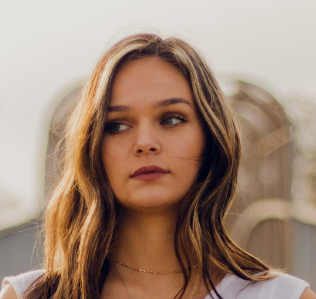 a young girl in a white shirt